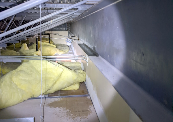 A significant leak into the dropped ceiling of an office building