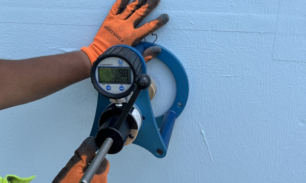 ASTM D4541 adhesion test on sheathing